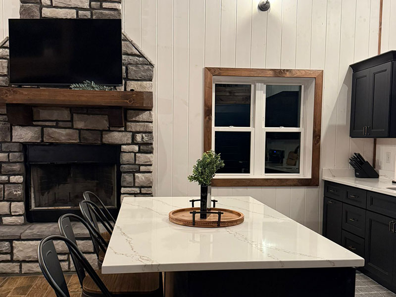 Chapter's End Back patio with cozy furniture and charcoal grill